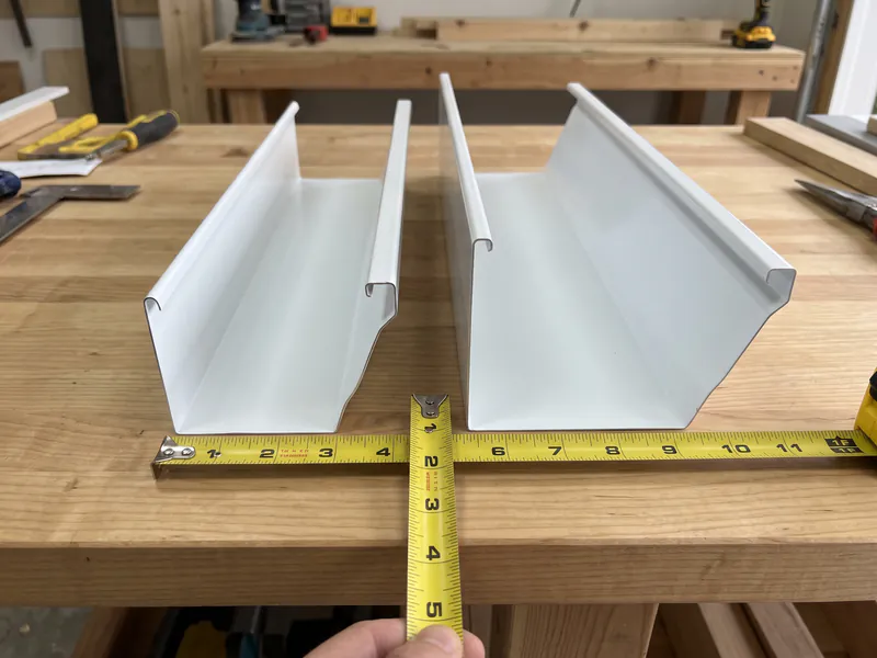 Cross-section comparison of 5-inch and 6-inch seamless K-style gutter profiles