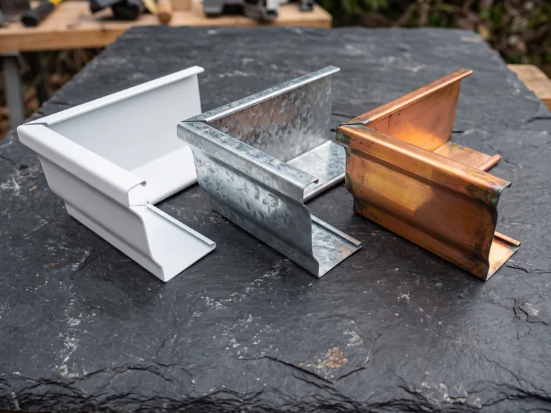Comparison of .032 aluminum, Galvalume steel, and copper gutter material samples