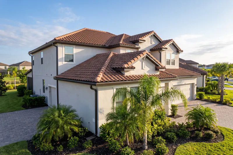 High-performance seamless gutter installation on residential vacation home near ChampionsGate in Davenport FL